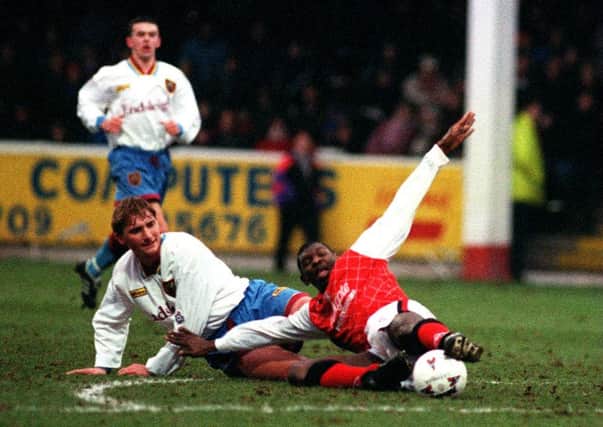 Feed the Goat: Shaun Goater, pictured sliding to win the ball, scored in normal play and in a shootout as Rotherham won the famous old competitions first ever penalty shootout.