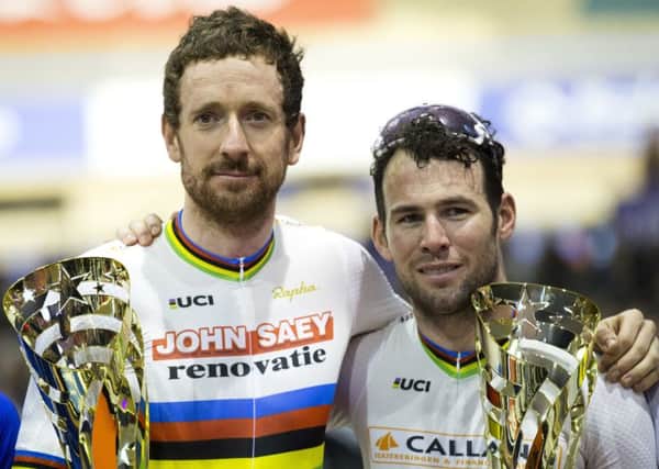 Bradley Wiggins, left, and Mark Cavendish pose with their trophies after winning the six-day race at 't Kuipke velodrome in Ghent, Belgium (Picture: Peter Dejong/AP).