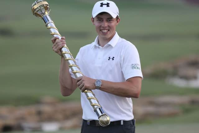 Matthew Fitzpatrick of England holds the trophy after he won the final round of the DP World Tour Championship. (AP Photo/Kamran Jebreili)