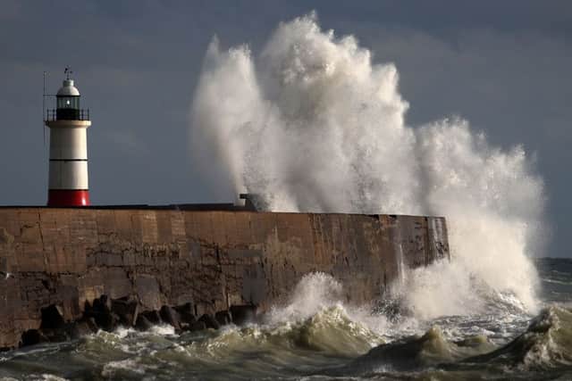 Waves crash into the wall at Newhaven in East Sussex