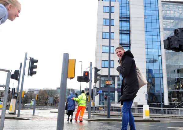 29 November 2015 .......      Pedestrians battle the blustery winds around Bridgewater Place in Leeds. Picture Tony Johnson
