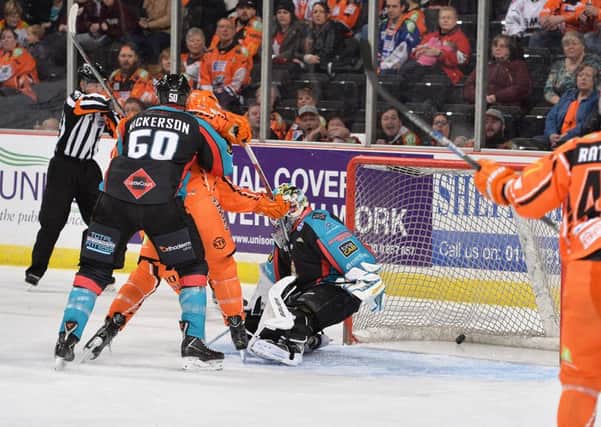 Mathiue Roy puts Sheffield Steelers ahead against Belfast Giants on Sunday night. Picture: Dean Woolley.