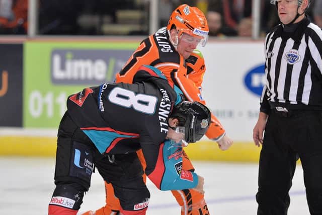 David Phillips gets to grips with Belfast's Michael Quesnele at Sheffield Arena. Picture: Dean Woolley.