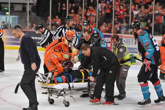 Belfast Giants' David Rutherford is stretchered off towards the end of the second period. Picture: Dean Woolley.