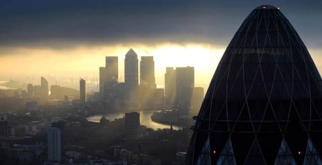 Sunrise in the City of London  Photo: Stefan Rousseau/PA Wire