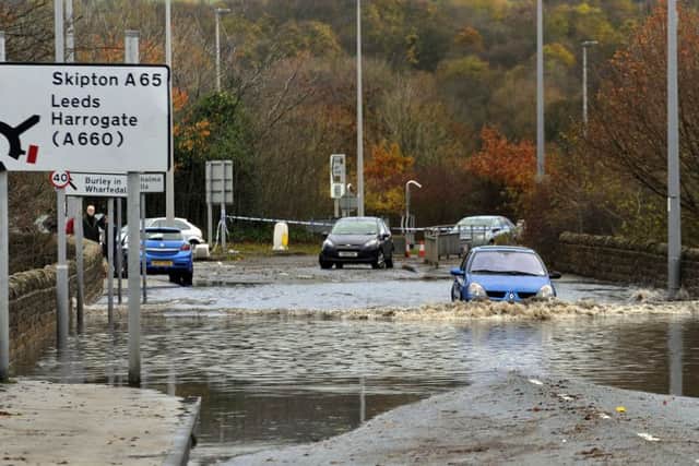Abandoned cars are left on the A65 near Ilkley.
