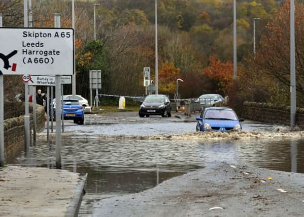 Abandoned cars are left on the A65 near Ilkley.