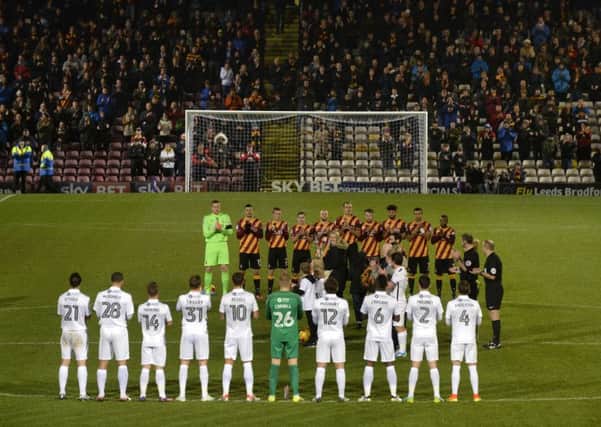 Bradford City and Northampton players, and the match officials, join in with a minutes applause for the late Bobby Campbell, a Bantams legend (Picture: Bruce Rollinson).