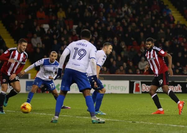 Ethan Ebanks-Landell scores to win the points for Sheffield United after Bury seemed set to deny them despite being reduced to nine men (Picture: Simon Bellis/Sportimage).