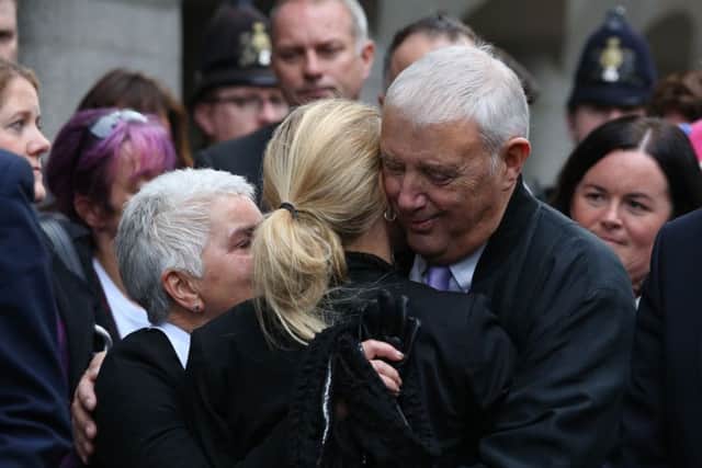 Jo Cox's parents Jean and Gordon Leadbeater embrace her sister Kim outside the Old Bailey after Thomas Mair was found guilty of the murder of the Labour MP