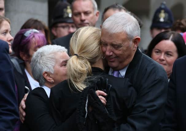 Jo Cox's parents Jean and Gordon Leadbeater embrace her sister Kim outside the Old Bailey after Thomas Mair was found guilty of the murder of the Labour MP
