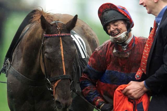 Richard Guest shows his delight after riding Red Marauder to victory in the 2001 Grand National at Aintree. Picture: Owen Humphreys/PA.