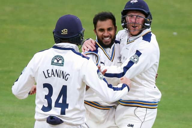 WANTED: Yorkshire's Adil Rashid (centre) is congratulated by Jack Leaning and then captain Andrew Gale after dismissing Lancashire's Kyle Jarvis in July this year. Picture: Alex Whitehead/SWpix.com