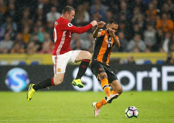 Hull City's Ahmed Elmohamady, seen duelling with Wayne Rooney, will miss the away match with Manchester United because of international duty (Picture: Danny Lawson/PA Wire).
