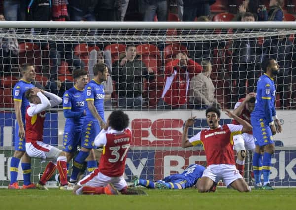 Rotherham United players were left on their knees after a stoppage-time chance to equalise went begging in the Championship defeat to Leeds United at the New York Stadium (Picture: Bruce Rollinson).