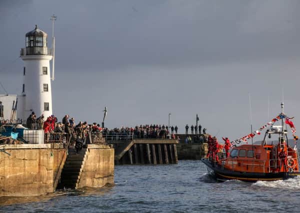 Crowds welcome the new Shannon class Scarborough Lifeboat 13-15, which arrived at precisely 13.15 hours, as it arrives in South Bay accompanied by a flotilla of yachts; excited Sea Cadets welcome the resorts new lifesaving acquisition. Picture:  Ceri Oakes.