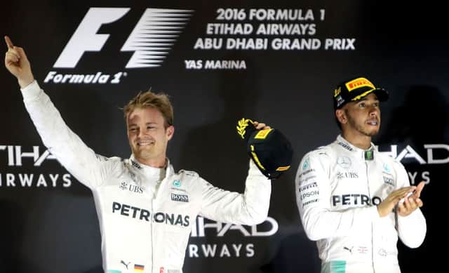 Nico Rosberg celebrates winning the Formula 1 drivers title at the expense of his Mercedes team-mate Lewis Hamilton.