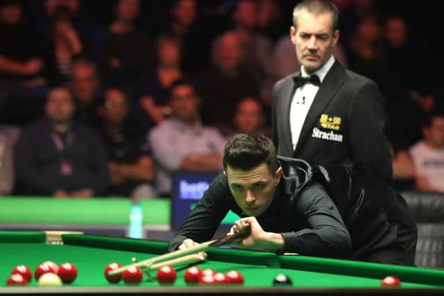 Oliver Lines in action against Judd Trump.