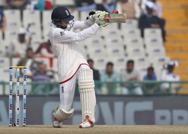 England's Haseeb Hameed hits a boundary on the fourth day of the third Test against India in Mohali (Picture: Altaf Qadri/AP).