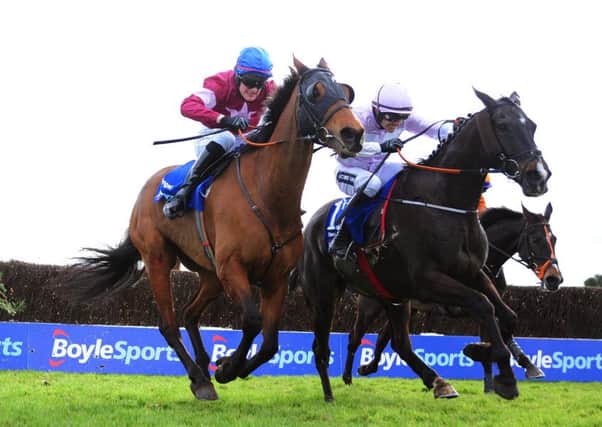 Rogue Angel, ridden by Ger Fox, on its way to winning the Boylesports Irish Grand National Chase (Picture: PA Wire).