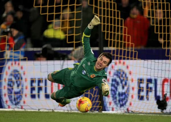 Hull City goalkeeper Eldin Jakupovic saves from Newcastle United's Jonjo Shelvey. Picture: Mike Egerton/PA.