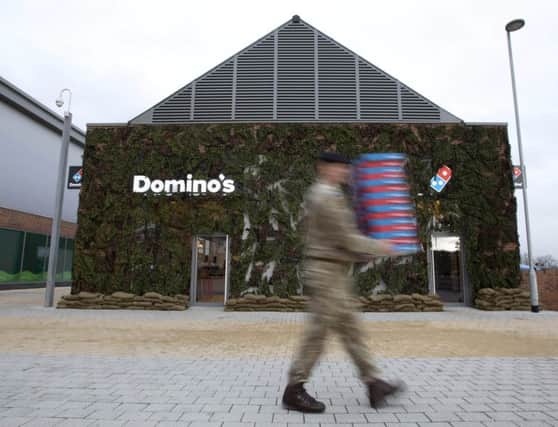 A local serviceman visits the new Domino's pizza store in Catterick Garrison