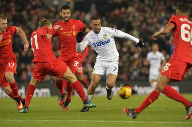Kemar Roofe, who struck a post for Leeds, battles through the Liverpool defence at Anfield. (Picture: Bruce Rollinson)