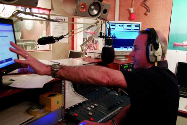 Presenter Chris Pearson in the Radio Caroline studio on the MV Ross Revenge