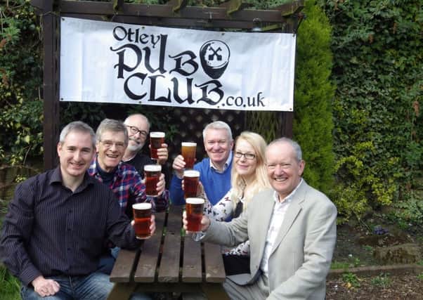 Ale trail: Otleys pubs are at the heart of community life in the market town. Greg Mulholland, front left, seen here with members of Otley Pub Club.