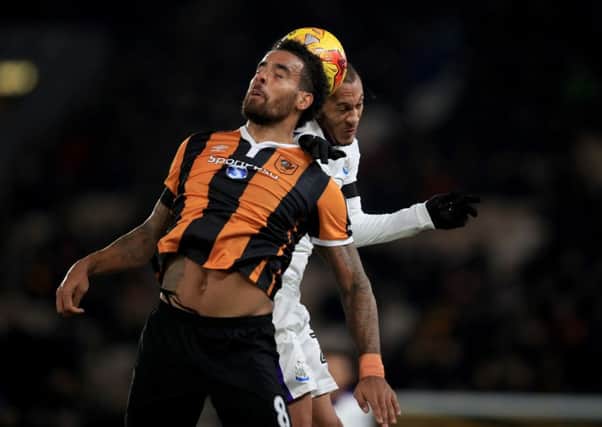 Hull City's Tom Huddlestone (left) and Newcastle United's Yoan Gouffran (right) battle for the ball (Picture: PA)