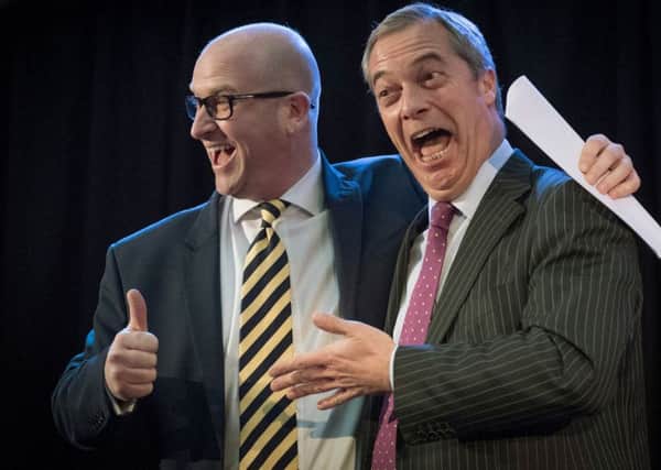 Paul Nuttall (left) is congratulated by Nigel Farage after he was announced as the new Ukip leader at the Emmanuel Centre in Westminster, London.