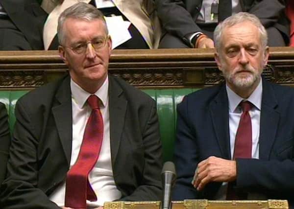 Hilary Benn and Jeremy Corbyn sit stony-faced in the Commons when the Leeds Central MP was Shadow Foreign Secretary.