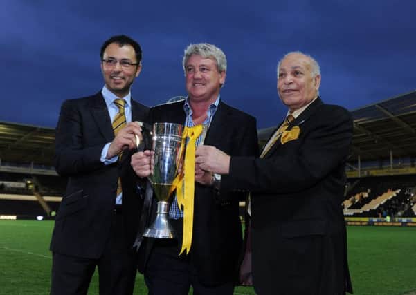 HAPPIER TIMES: Hull City manager Steve Bruce, centre, with owners Ehab Allam, left and Dr Assem Allam with the Championship runners-up trophy back in 2013. Picture: Tony Johnson.