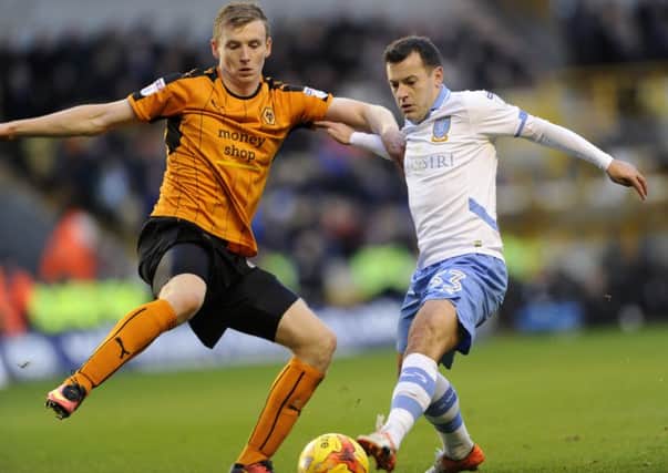 Sheffield Wednesday's Ross Wallace with Wolverhampton's Jon Dadi Bodvarsson. (Picture: Steve Ellis).
