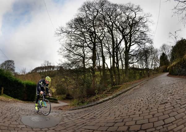 Local cyclist Matt Denby tackles the 15% cobbles of Shibden Wall which will feature in the 3rd and final stage of the 2017 Tour de Yorkshire. PIC: Bruce Rollinson