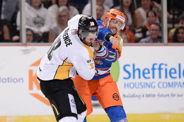 SO, WE MEET AGAIN: Sheffield Steelers' Guillaume Desbiens, right, gets to grips with Chris Lawrence in an earlier meeting between the two clubs this season. Picture: Dean Woolley.