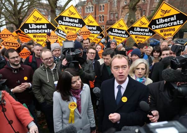 Party leader Tim Farron and newly-elected Liberal Democrat MP Sarah Olney speak to the media on Richmond Green after she won the Richmond Park by-election.