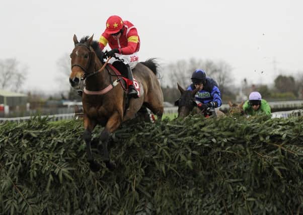 Highland Lodge and Henry Brooke are pictured  jumping the final fence on their way to winning the Betfred Becher Chase at Aintree a year ago today but they were edged into second on Saturday (Picture: John Giles/PA Wire).