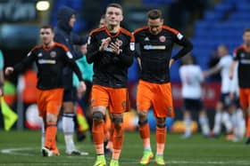 A dejected Caolan Lavery of Sheffield Utd leads the players in applauding the fansafter FA Cup defeat to Bolton. Picture: Simon Bellis/Sportimage.