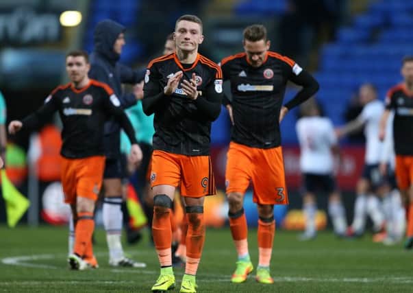 A dejected Caolan Lavery of Sheffield Utd leads the players in applauding the fansafter FA Cup defeat to Bolton. Picture: Simon Bellis/Sportimage.