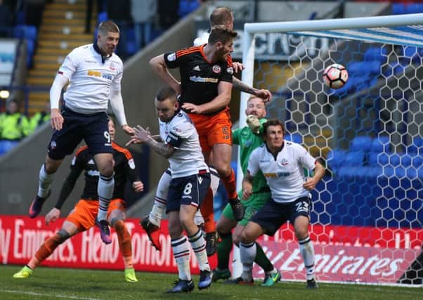 Sheffield United's Jack OConnell rises to score a late goal that reduced Bolton Wanderers lead to 3-2 but the hosts held on to progress into the third round of the FA Cup (Picture: Simon Bellis/Sportimage).