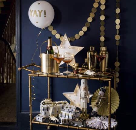 A trolley could be the answer to your Christmas table problems. The items on this one are all from House of Fraser