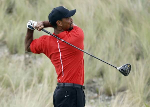 Tiger Woods watches his tee shot at the third hole during the final round of the Hero World Challenge (Picture: Lynne Sladky/AP).