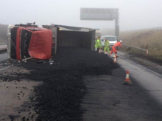 This overturned lorry is one of the incidents causing issues on the A180. Picture: Humberside Roads Police