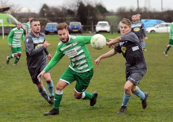 Tom Charles of Kippax finds a gap in the Swillington defence