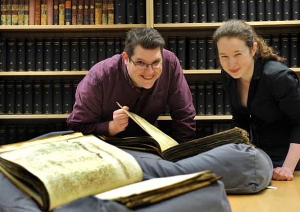061216   Gary Brannan  Access Archivist for the Borthwick Institute  and Catherine Dann a Conservator  with two  books of Wills  dating from 1576 that are being digitised by the University of York  at The Borthwick Institute within the University of York Llibrary.