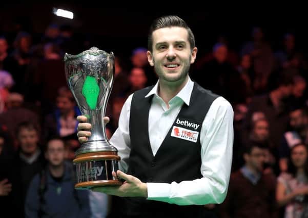 Mark Selby celebrates with the Betway UK Championship trophy after victory over Ronnie O'Sullivan (Photo: PA)
