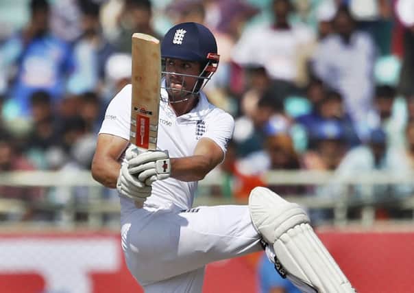 England's captain Alastair Cook plays a shot on the fourth day of their second cricket test match against India in Visakhapatnam, India. (AP Photo/Aijaz Rahi)