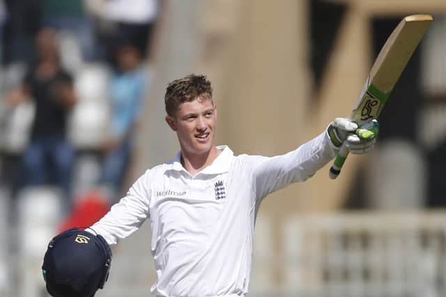 England's batsman Keaton Jennings raises his bat after scoring century on the first day of the fourth cricket test match between India and England in Mumbai, India. (AP Photo/Rafiq Maqbool)