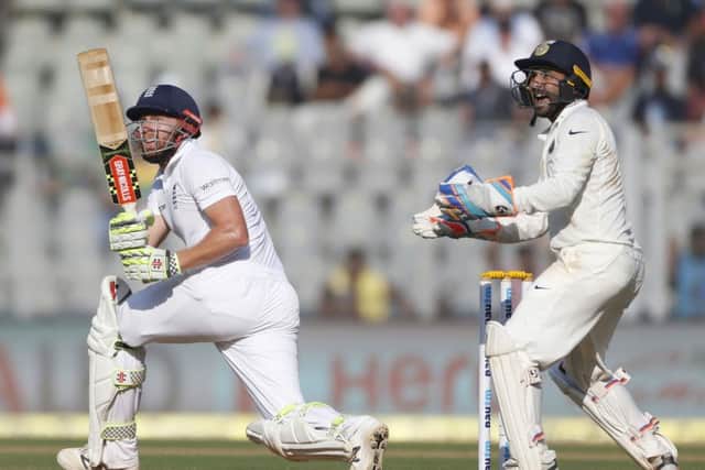 England's batsman Jonny Bairstow left, bats on the first day of the fourth cricket test match between India and England in Mumbai. (AP Photo/Rafiq Maqbool)